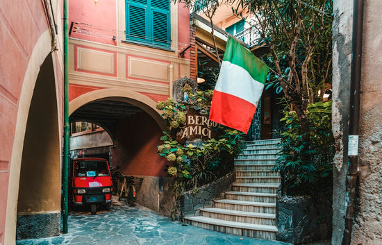 red auto-rickshaw under arch walkway